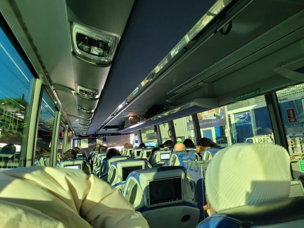 photo of the inside of an ALSA bus in Spain, showing the tv screens in headrests