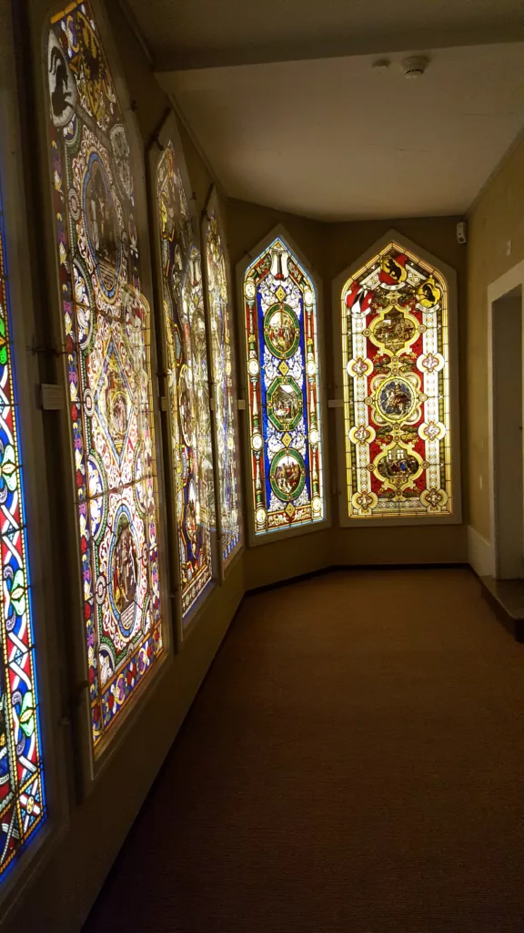 Photo of stained glass windows inside Oberhofen Castle in Switzerland