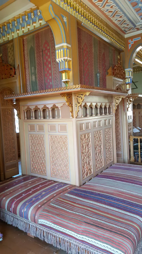 Photo of wood paneling and detail inside the oriental smoking room at Oberhofen Castle in Switzerland