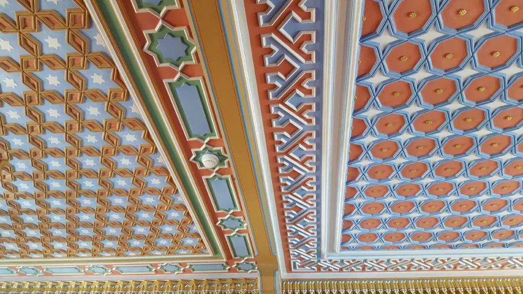 photo of the detailed and colorful paneling inside the oriental smoking room of Oberhofen Castle in Switzerland