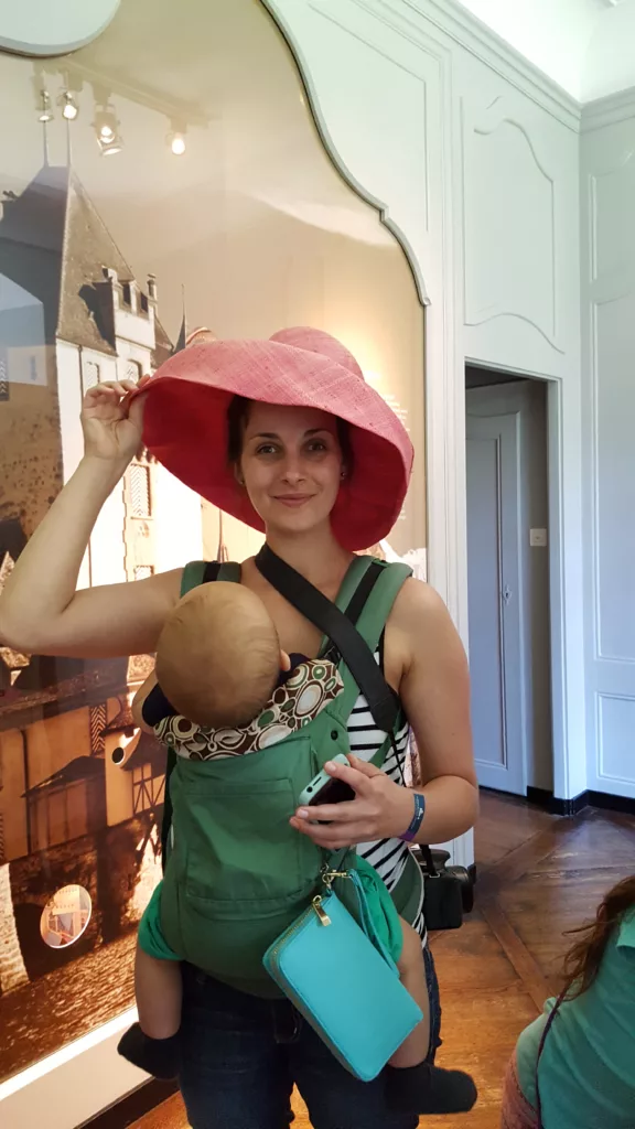 lady wearing a costume hat inside the dress up area at Oberhofen Castle in Switzerland