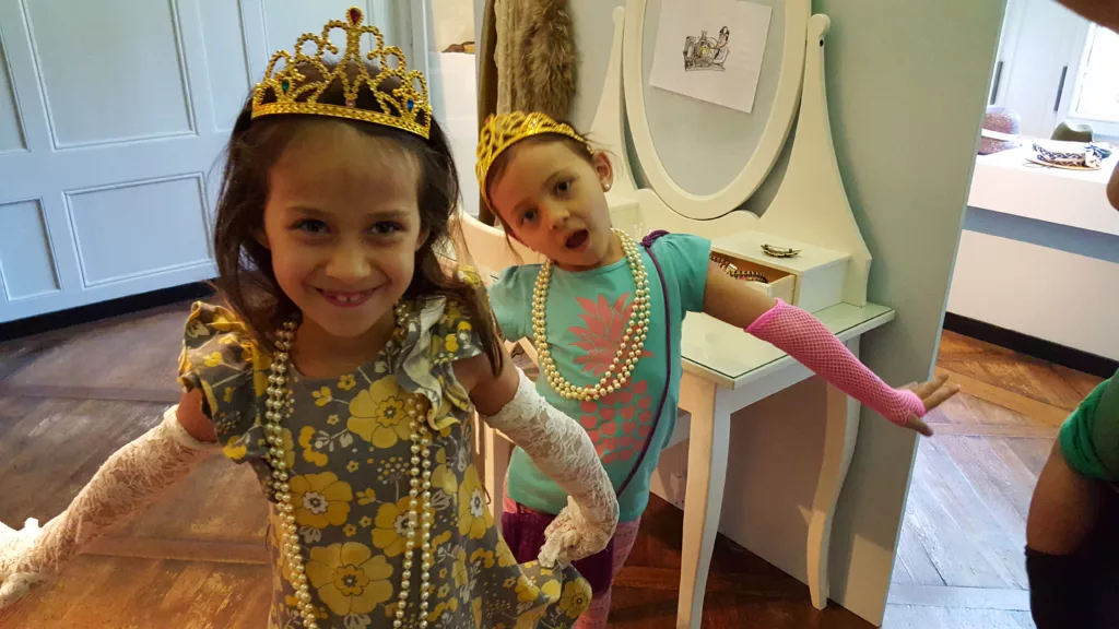 Two young girls dressed up in princess costume at Oberhofen Castle in Switzerland