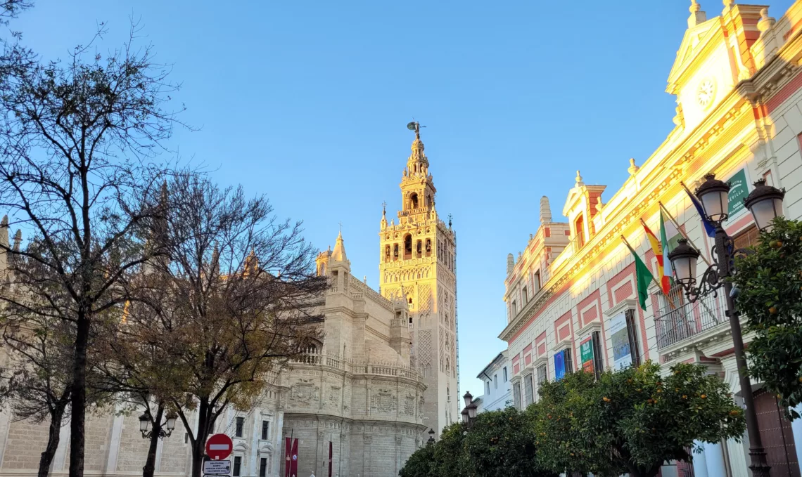 Photo of Seville Cathedral and Giralda Tower at sunset