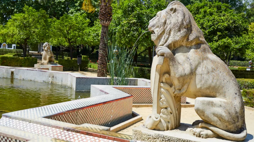 Lion statue at the Fountain of the Lions at Maria Luisa Park in Seville