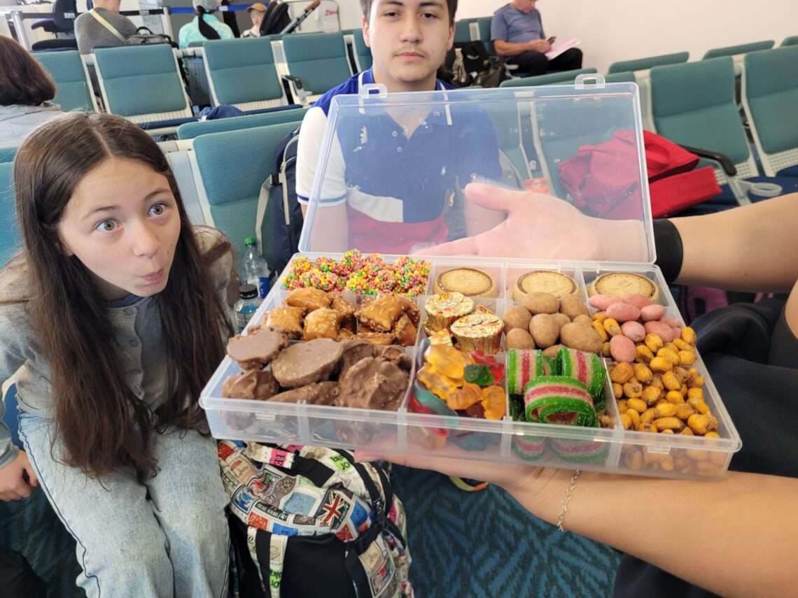 child at airport looking in amazement at snackle box