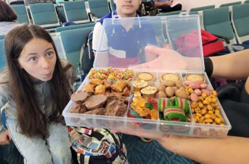 child at airport looking in amazement at snackle box